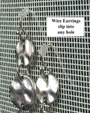 Wire earrings hang in an Earring Holder by Earring Holder Gallery