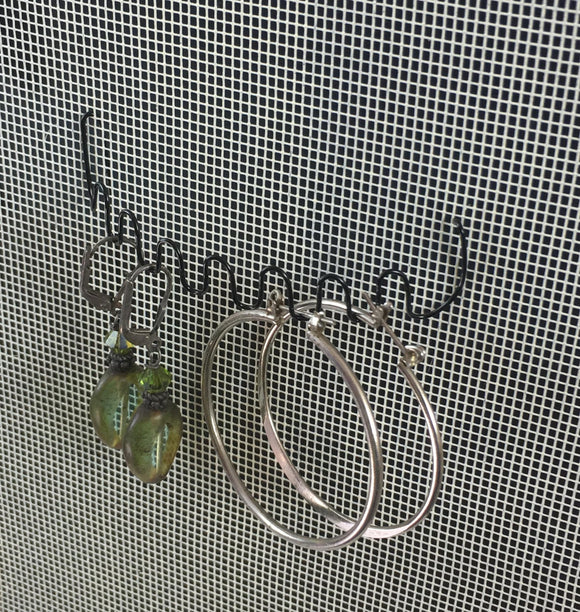 hoop earrings hang on a Wire Thingy in an earring holder